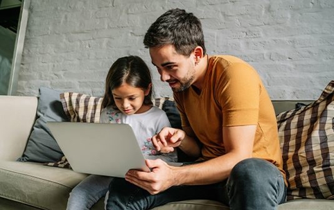 Father and child using computer